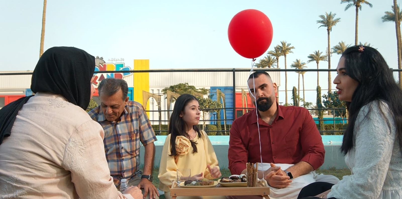 A family gathered for a picnic in a park
